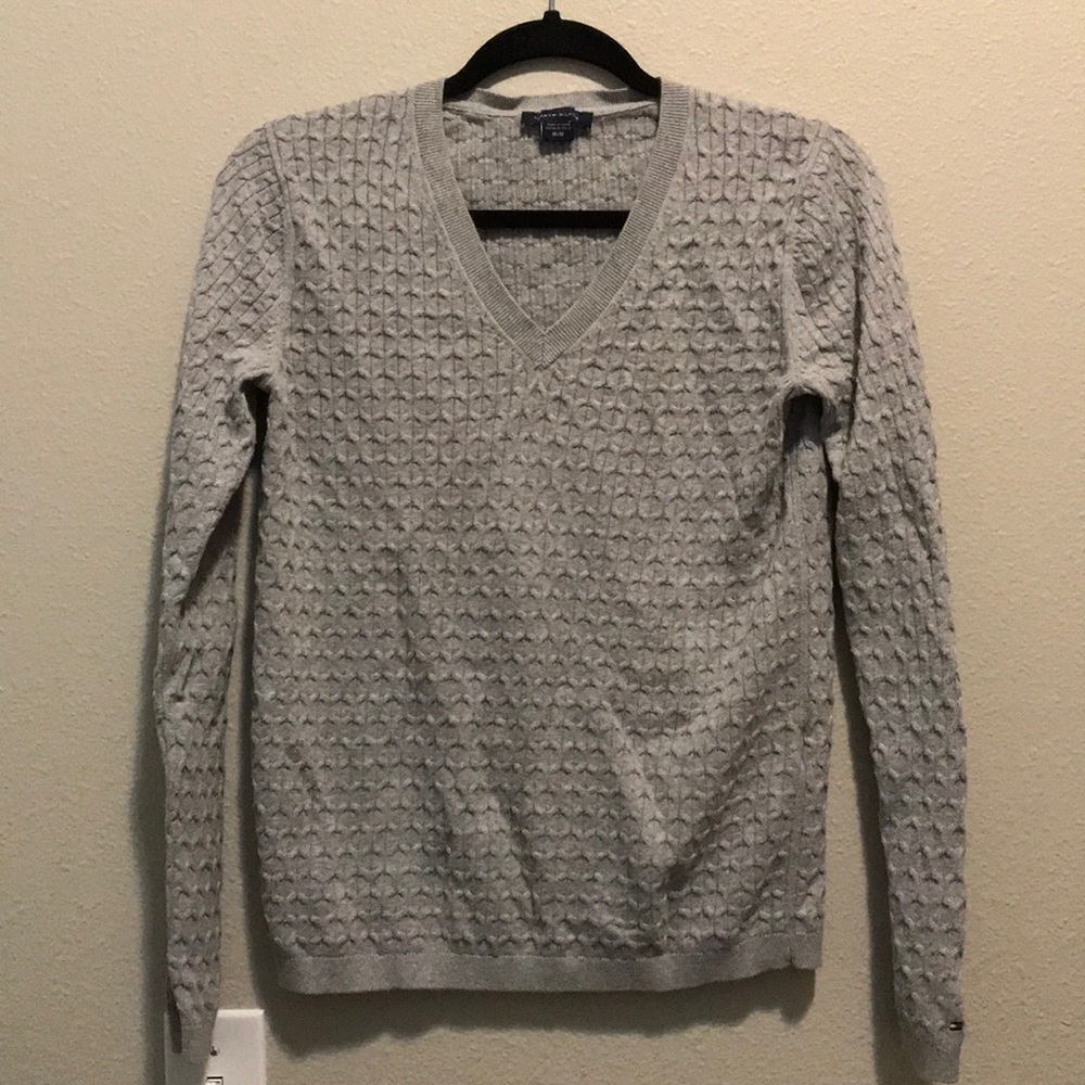 Grey light knit sweater.